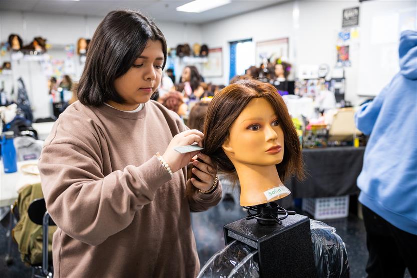 Centennial High students in the cosmetology class